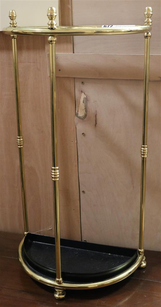 A brass umbrella stand